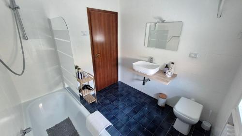a bathroom with a sink and a toilet and a shower at La Daiana in Imola