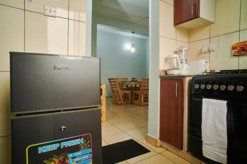 Kuchyň nebo kuchyňský kout v ubytování Bluezone Residence