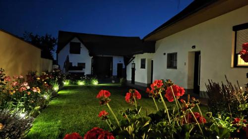 a house with a yard with flowers and lights at FERIENHAUS Weinviertel in Pernersdorf