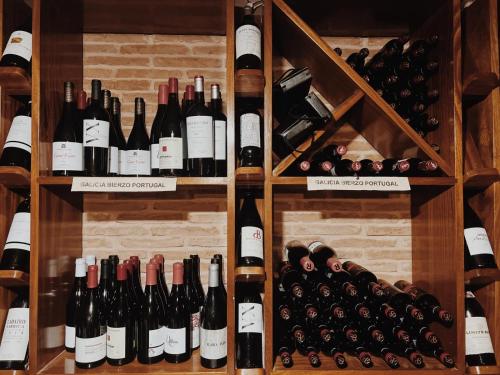 a bunch of wine bottles in a wine cellar at Doade in Hio