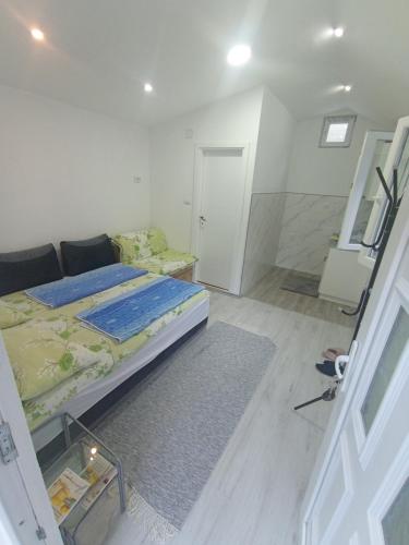 Una cama o camas en una habitación de Rzav Višegrad centar