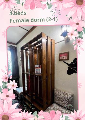 a picture of a room with a mirror with pink flowers at DRIMIN - by Sunrise Caravan boutique Guesthouse and hostel in Tashkent