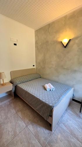 Ένα ή περισσότερα κρεβάτια σε δωμάτιο στο Hotel Il Gabbiano