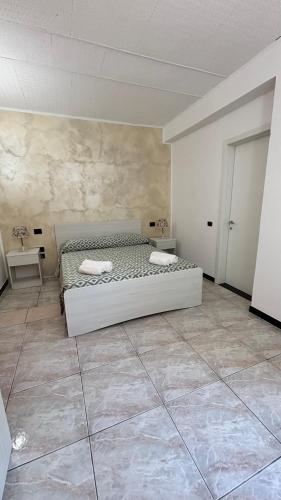 Ένα ή περισσότερα κρεβάτια σε δωμάτιο στο Hotel Il Gabbiano