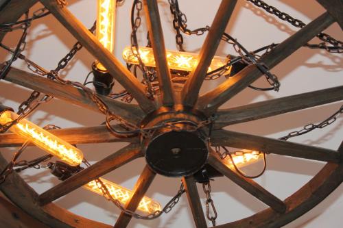 a chandelier hanging from a ceiling with chains at Refresh Club wellness Ostrava in Poruba
