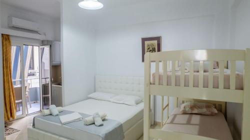 a bedroom with a bunk bed and a bunk bed at Andy Apartments in Sarandë