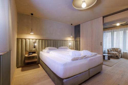 Ein Bett oder Betten in einem Zimmer der Unterkunft Hotel Bäckelar Wirt Superior