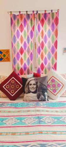 a bed with a picture of a woman on it at Riad SULTANA lateral seaview in Saidia 