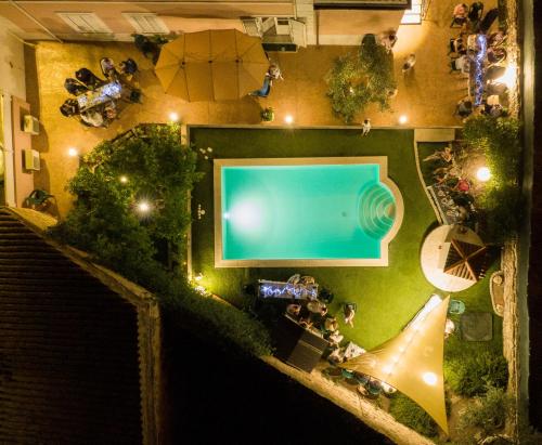 an overhead view of a swimming pool at night at Villa Teresa in Oschiri