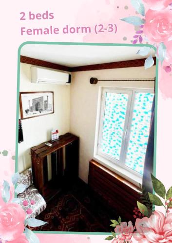 a room with a fireplace and a window at DRIMIN - by Sunrise Caravan boutique Guesthouse and hostel in Tashkent
