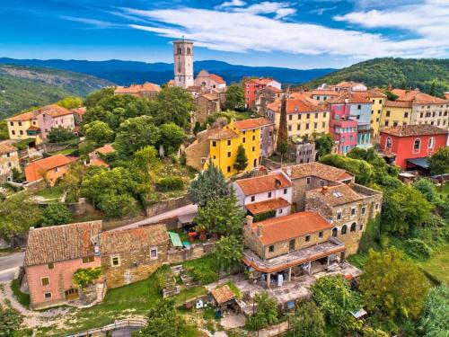 an aerial view of a village with buildings at App Damiani in Oprtalj