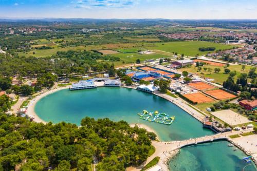 an aerial view of a harbor with boats in the water at App Damiani in Oprtalj
