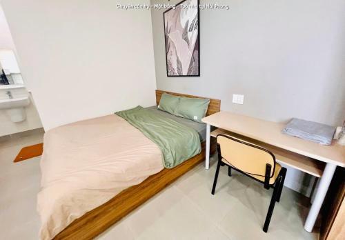a small bedroom with a bed and a desk at HPT Home II Vinhome Marina chuỗi Apartment - Homestay in Hai Phong