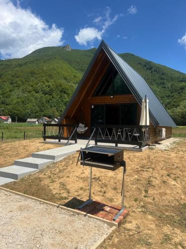 a building with a grill in front of it at Vila Jezero-Jajce in Jezero