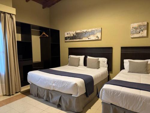 Ένα ή περισσότερα κρεβάτια σε δωμάτιο στο LAS SALINAS GRAN HOTEL