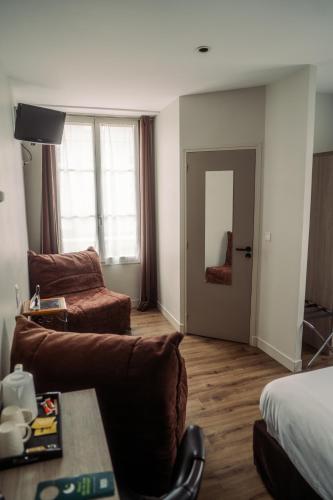 Χώρος καθιστικού στο LOGIS -Hotel & Restaurant de la Place