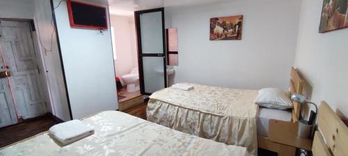 Postel nebo postele na pokoji v ubytování Casa Anais y Nicolas