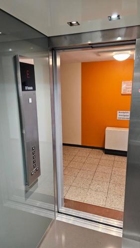 an open door of a room with a hallway at "Sunny" in Burgtiefe auf Fehmarn 