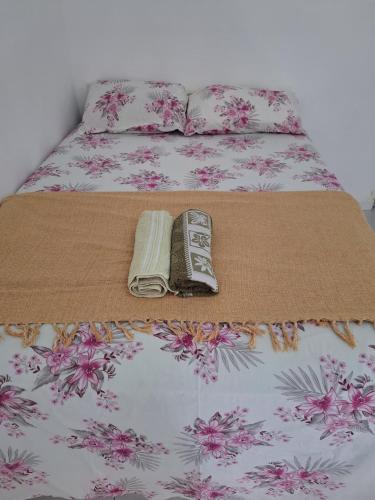 Postel nebo postele na pokoji v ubytování Quarto Confortável no Centro