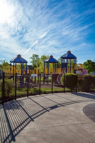 a playground with two swings and a play structure at The Lynx - 35 Butternut in Cherry Valley