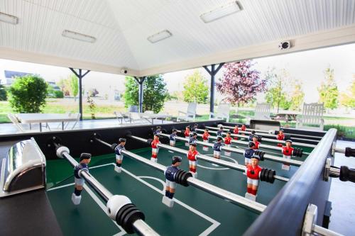 a group of lego men playing a game on a table at The Lynx - 35 Butternut in Cherry Valley