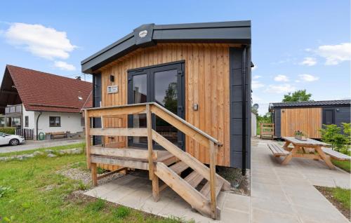 a wooden tiny house with a black roof at Gorgeous Home In Erkheim With Wifi in Erkheim