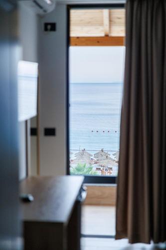 a view of the ocean from a window in a room at Hotel Juza in Borsh