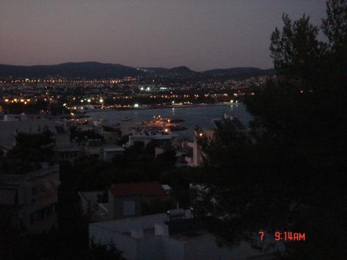 a view of a city at night with a river at RELAX WITH SEA VIEW No 1!!!! in Varkiza