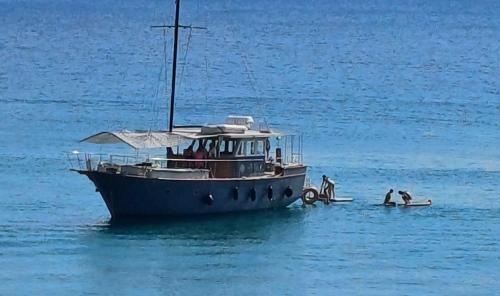 a group of people on a boat in the water at RELAX WITH SEA VIEW No 1!!!! in Varkiza