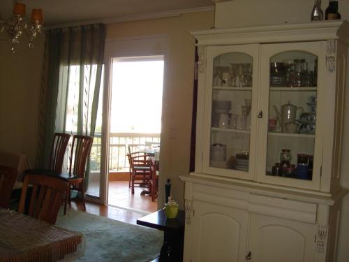 a kitchen with a hutch and a dining room at RELAX WITH SEA VIEW No 1!!!! in Varkiza