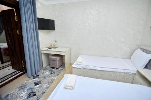 Ένα ή περισσότερα κρεβάτια σε δωμάτιο στο Guest house Mullo Kalandar