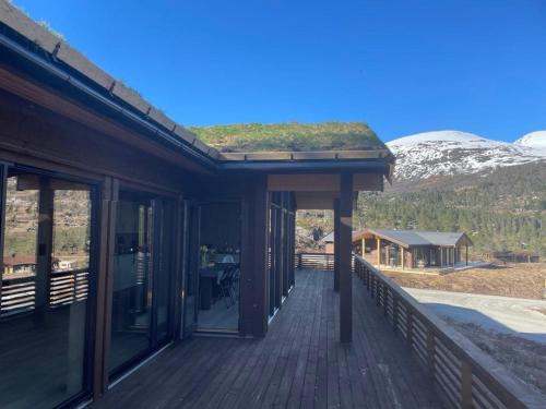 a house with a roof with a green roof at Moderne og romslig familiehytte i Stryn in Stryn