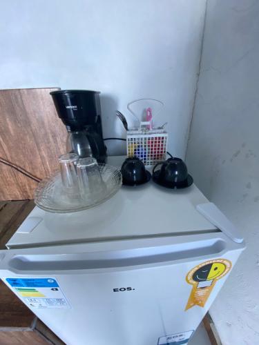 Η κουζίνα ή μικρή κουζίνα στο SUÍTES BEIRA-MAR Angra