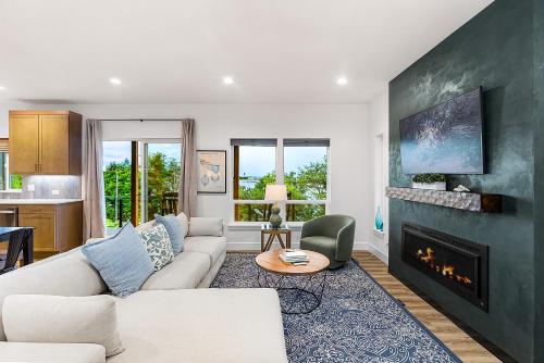 a living room with a couch and a fireplace at Cedarcrest House in Blaine