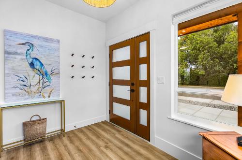 a hallway with a door and a window at Cedarcrest House in Blaine