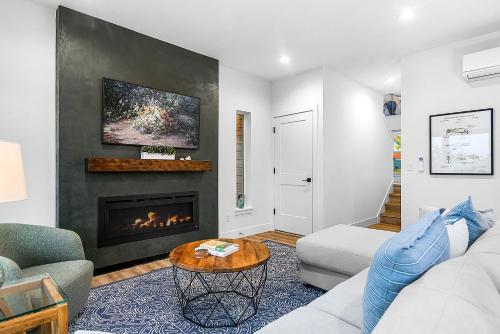 a living room with a couch and a fireplace at Cedarcrest House in Blaine