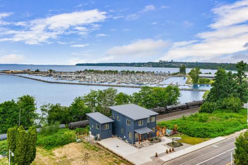 an aerial view of a blue house next to a marina at Cedarcrest House in Blaine