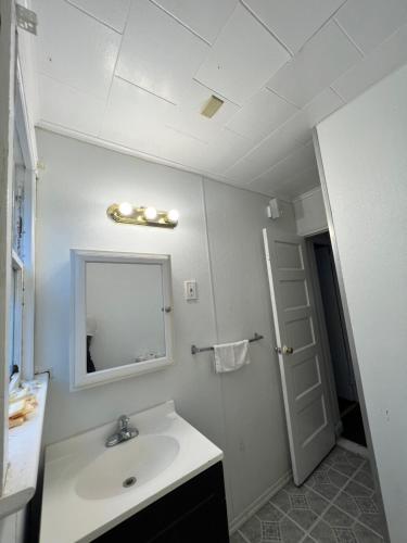 a bathroom with a sink and a mirror at Shore Beach Houses - 38 D Lincoln Avenue in Seaside Heights