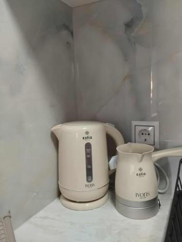 two appliances sitting on top of a kitchen counter at Thanos Cozy Apartments in Skala Kallonis