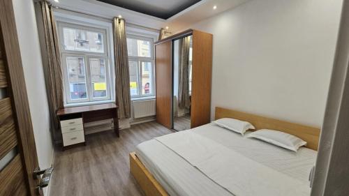 Кровать или кровати в номере Relax Apartment