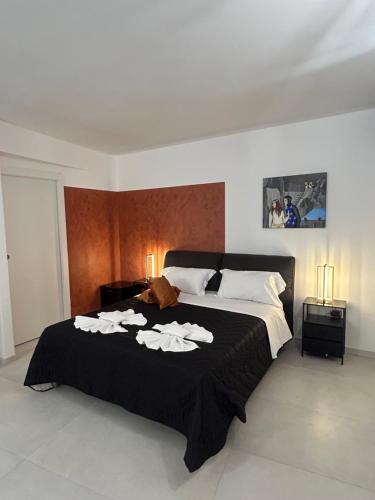 Giường trong phòng chung tại Gammazita Luxury Home