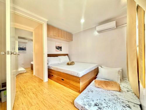 Ένα ή περισσότερα κρεβάτια σε δωμάτιο στο Unit 3 - Affordable Home Near Mactan Cebu Airport