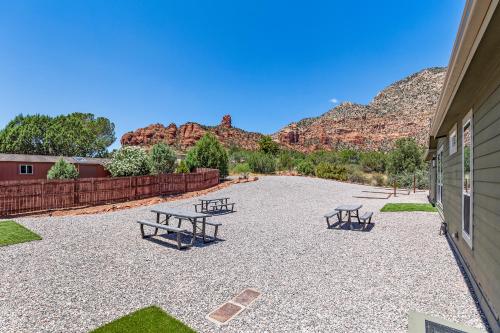 a patio with picnic tables and mountains in the background at Andante Trail - Unit A - Red Rock Retreat in Sedona