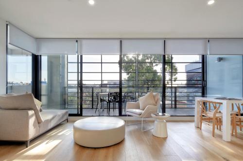 a living room with a couch and a table at 381 Cremorne in Melbourne