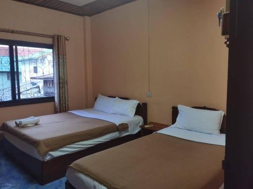 Katil atau katil-katil dalam bilik di Oudomphone Guesthouse 2