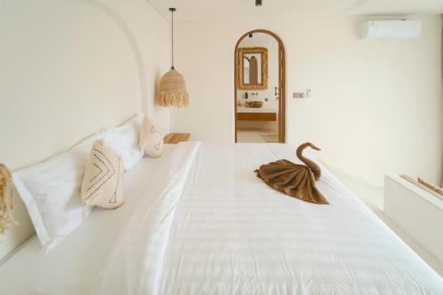 Ένα ή περισσότερα κρεβάτια σε δωμάτιο στο Casa Luna Penida