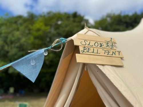 a sign on the side of a bell tent at Readers Field Glamping in Great Sampford