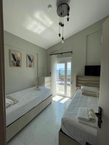 Ένα ή περισσότερα κρεβάτια σε δωμάτιο στο Platan Paradise