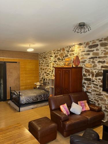 a living room with a couch and a bed at SUN SETE Loft in Sète