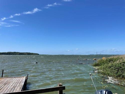a large body of water with people swimming in it at 4 person holiday home in SENOREN in Möcklö